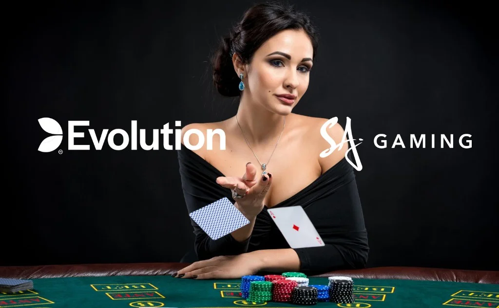 Live dealer at a baccarat table with Evolution and SA Gaming logos on a dark background